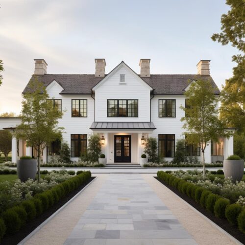 A luxury white modern colonial house exterior with garden.