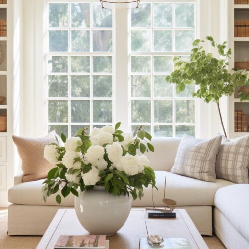 A white cottage living room with a white sectional.